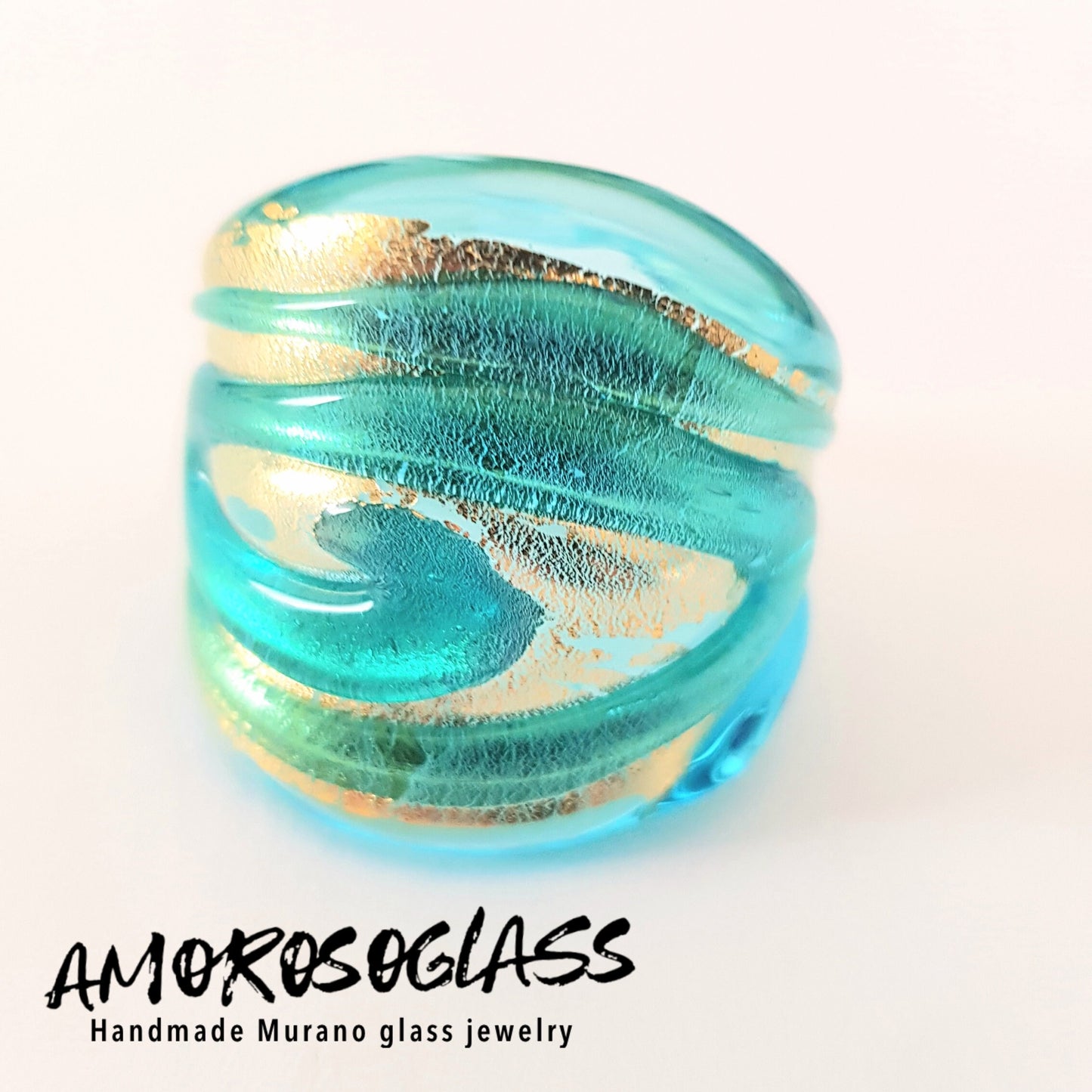 Anello VORTICE a fascia, base acquamare trasparente con foglia oro24kt e vortice acquamare trasparente,in vetro di Murano lavorato a lume.