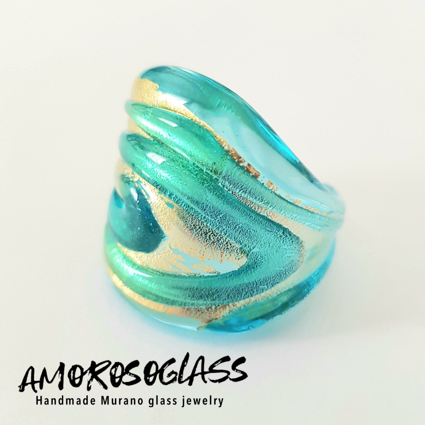 Anello VORTICE a fascia, base acquamare trasparente con foglia oro24kt e vortice acquamare trasparente,in vetro di Murano lavorato a lume.