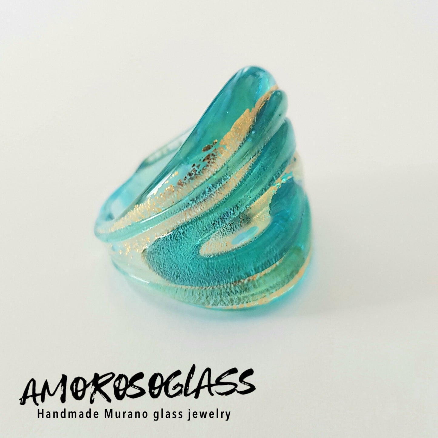 Anello VORTICE a fascia, base acquamare trasparente con foglia oro24kt e vortice acquamare trasparente,in vetro di Murano lavorato a lume.