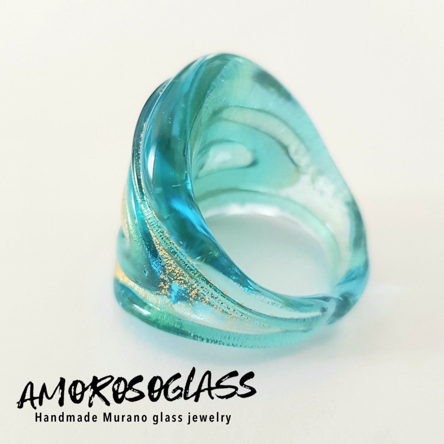 Anello VORTICE a fascia, base acquamare trasparente con foglia oro24kt e vortice acquamare trasparente,in vetro di Murano lavorato a lume.