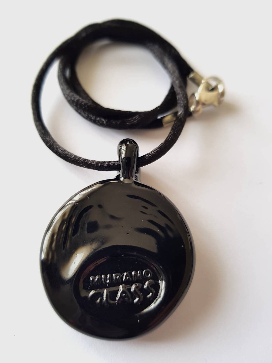 Impronta di zampetta di gatto in vetro di Murano lavorato a lume.